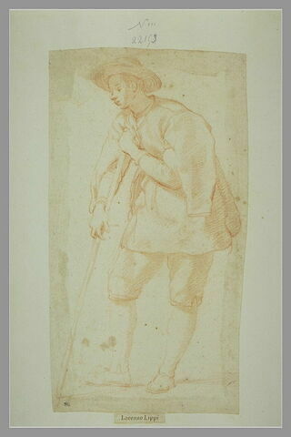 Jeune homme debout, appuyé sur un bâton, tourné vers la gauche, image 1/1