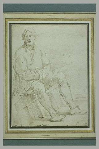 Homme assis, les bras croisés, sur le bord d'une barque, image 2/2