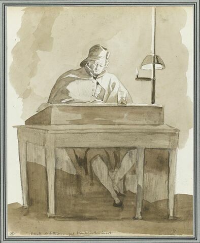 Homme assis à une table, travaillant à la lueur d'une lampe, image 1/2