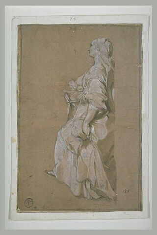 Une femme debout, portant une corbeille contenant une colombe, image 1/1