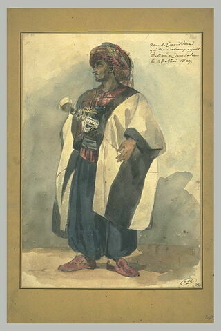 Oriental coiffé d'un turban bariolé et habillé d'un caftan blanc