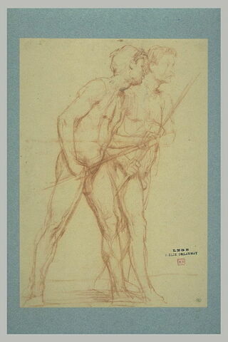 Deux hommes marchant parallèlement vers la droite, chacun portant un bâton, image 1/1