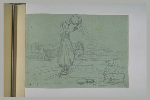 Femme, debout, agitant un tamis et jetant du grain, image 1/1