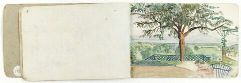 Femme lisant sur une terrasse surplombant un paysage, image 1/1