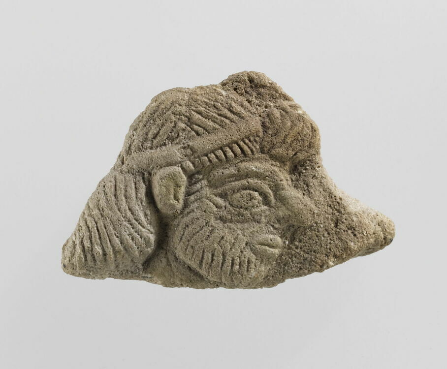 Brick or tile fragment with a character