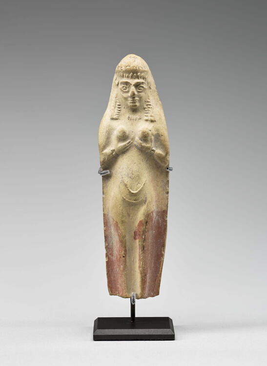 Molded statuette of a naked woman cupping her breasts