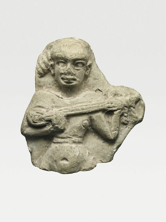 Moulded figurine of a lute player