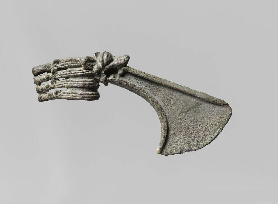 Axehead shaped like a horse head, with a lion head spitting the blade.