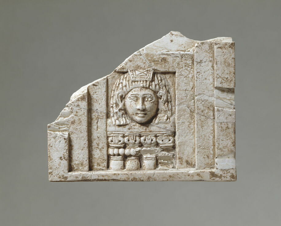 Plaque: woman looking through a window