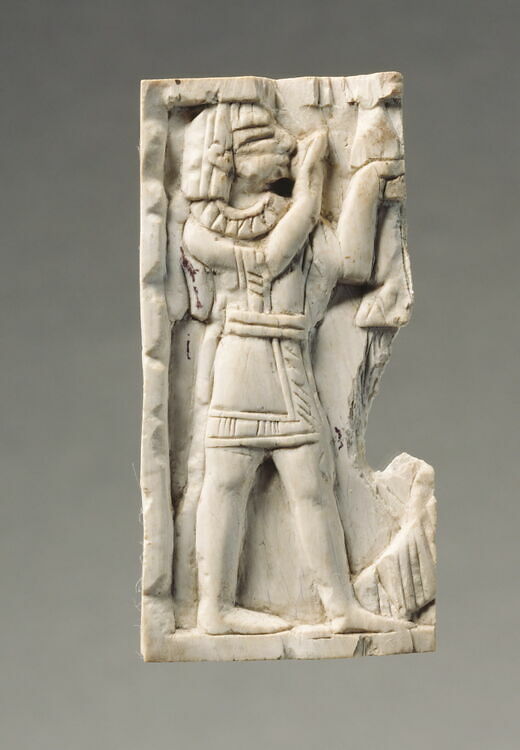 Plaque: Egyptian-style man with raised hands