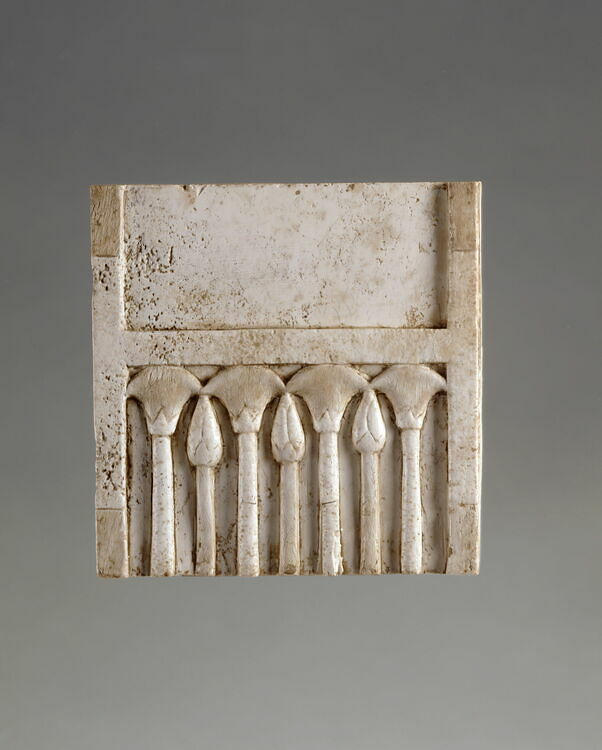 Plaque fragment: alterning papyrus flowers