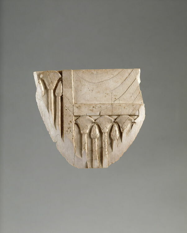 Plaque fragment: alterning papyrus flowers