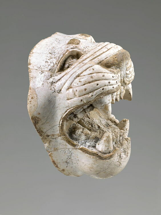 Plaque fragment: haut-relief lion head