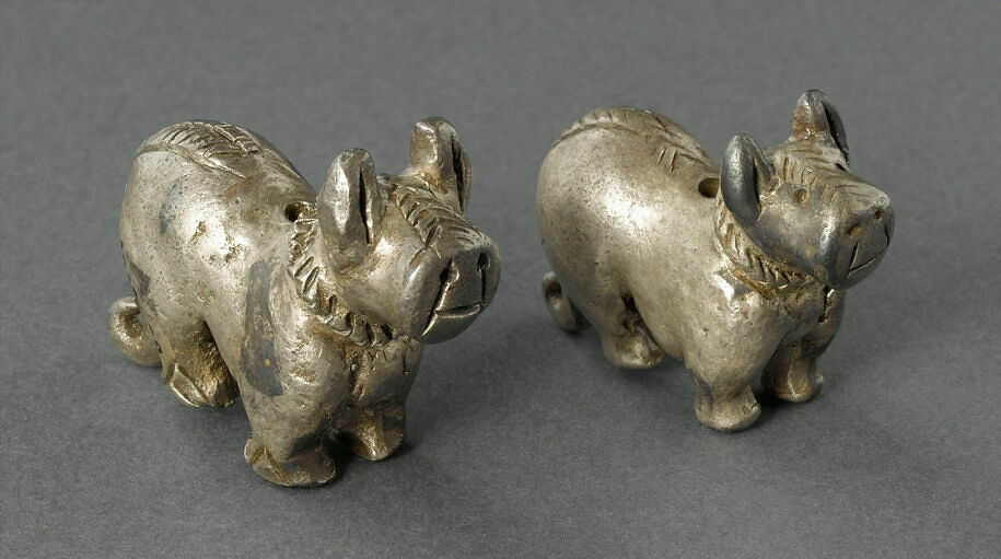 Statuette of little dog wearing a hatched collar