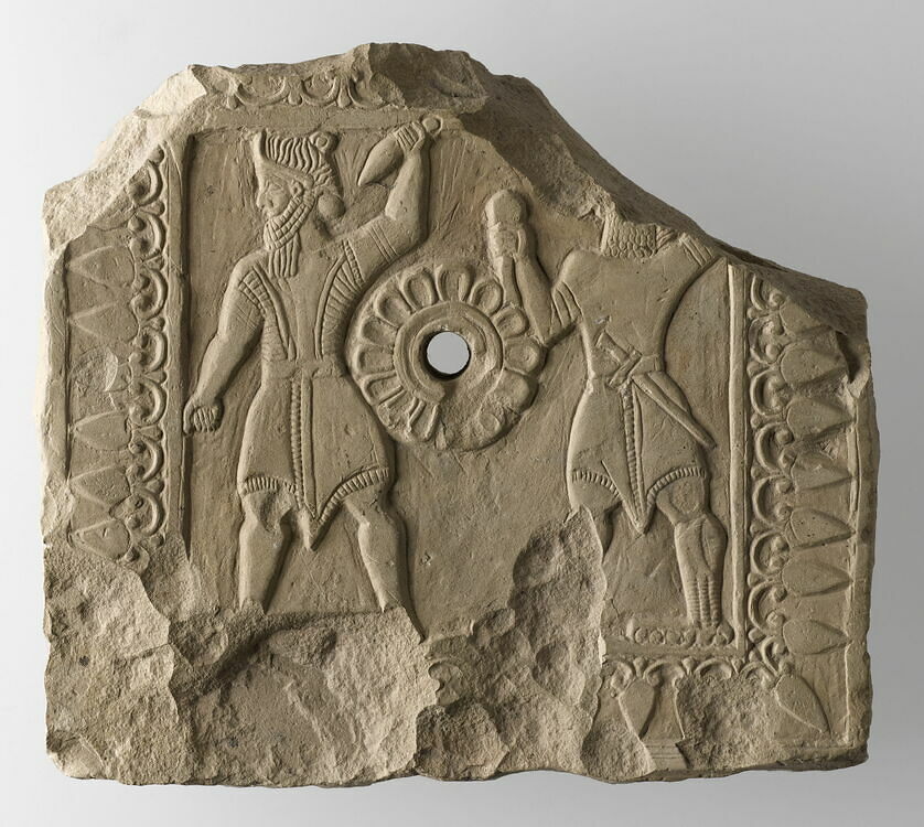 Appliqué decorated with a God-warrior and a deamon featuring talons