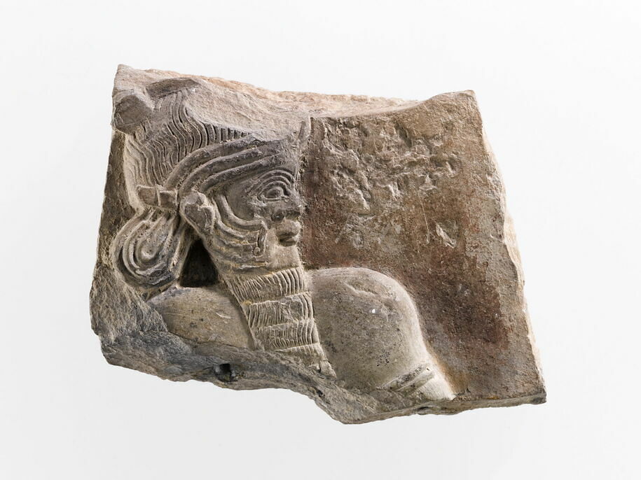 Bas-relief fragment representing a god