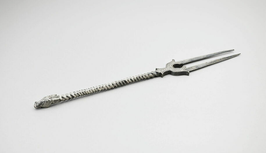 Two-toothed fork deorated with a horse head. Susa (Iran)
