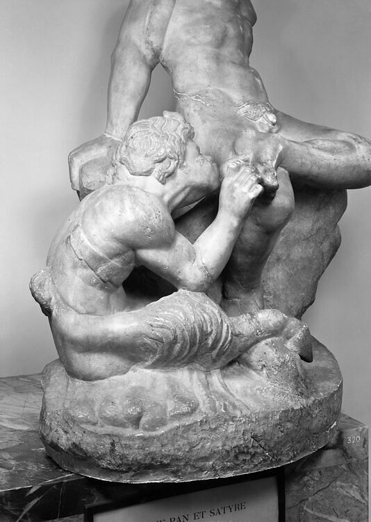 Pan removing a thorn from a satyr's foot
