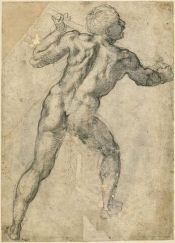 Homme debout, de dos, tenant un baton, image 3/3