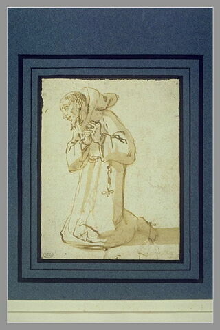 Saint François agenouillé, de profil vers la gauche, en prière