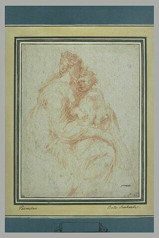 Une femme assise avec un enfant sur les genoux