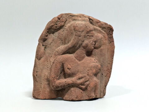 figurine féminine couchée