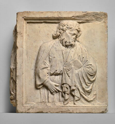 Prophète ou apôtre  barbu, visage de profil à droite, tête inclinée vers la gauche, tenant un livre