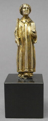 Statuette : un saint tenant une palme et un livre.