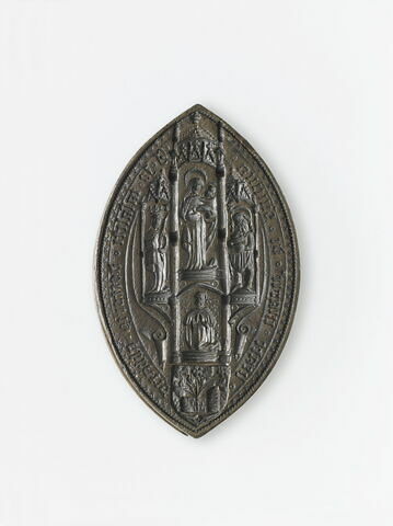 Matrice de sceau en forme de mandorle : Vierge à l'Enfant et trois saints.