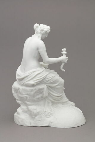 Statuette
Biscuit de porcelaine
 représentant une femme tenant un flambeau d'une main et une coupe de l'autre
Titre gravé : Message, image 2/4
