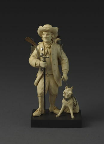 Statuette de colporteur : barbier ambulant avec son chien