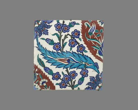 Carreau à décor de mandorles rouges et de feuilles saz bleues, image 1/2