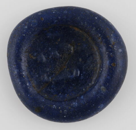 Disque orné de signes mystérieux, image 1/2