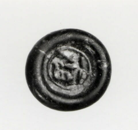Disque au nom du calife fatimide al-Hakim (r. 996-1021), image 1/2