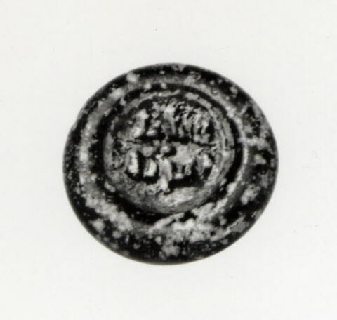 Disque au nom du calife fatimide al-Hakim (r. 996-1021), image 1/2