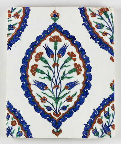 Carreau à décor de mandorles meublé d'un bouquet quatre fleurs, image 1/1