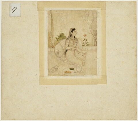 Jeune femme agenouillée tenant un flacon et une coupe, image 2/3