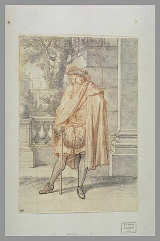 Un homme appuyé sur un bâton, couvert d'un manteau et portant un manchon, image 2/3
