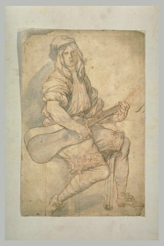 Jeune musicien assis, jouant de la guitare, image 1/1