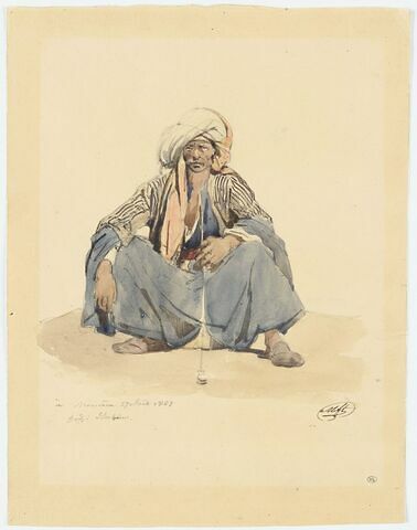 Libanais accroupi, fumant la pipe, coiffé d'un turban blanc
