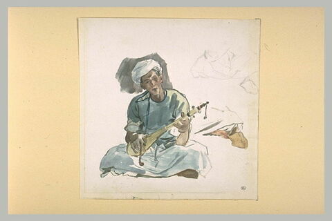 Un musicien arabe assis, image 2/2