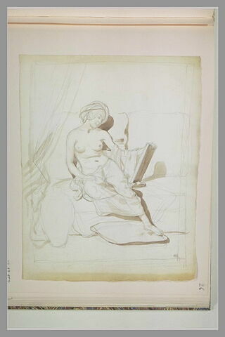 Jeune femme nue avec un turban, assise sur un divan, image 1/1