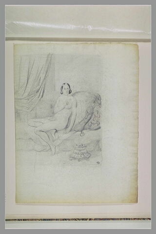 Femme nue, assise sur un divan