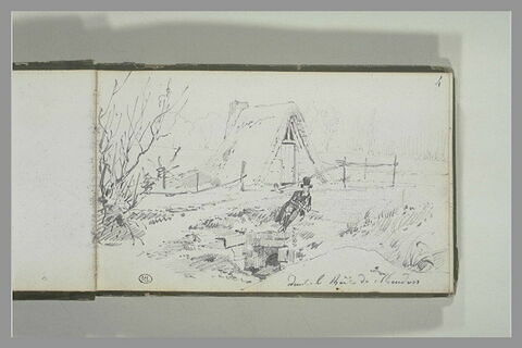 Homme assis devant une hutte dans le bois de Meudon