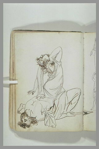 Femme désespérée  à côté d'un homme mort, gisant sur le sol, image 2/3