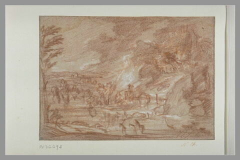 Construction précédée d'un lac dans un paysage rocheux, image 2/2