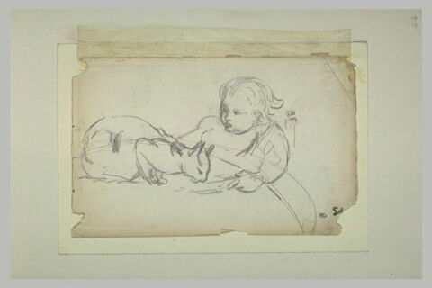 Enfant assis donnant à boire à un chat, image 1/1