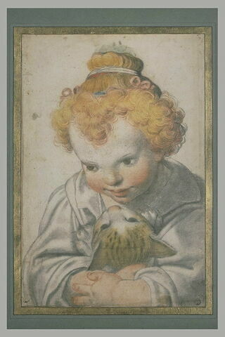 Enfant, vu en buste, tenant un chat entre ses bras, image 2/2