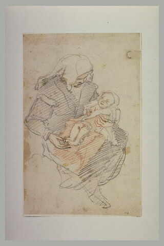 Femme assise tenant un enfant sur les genoux, image 1/1