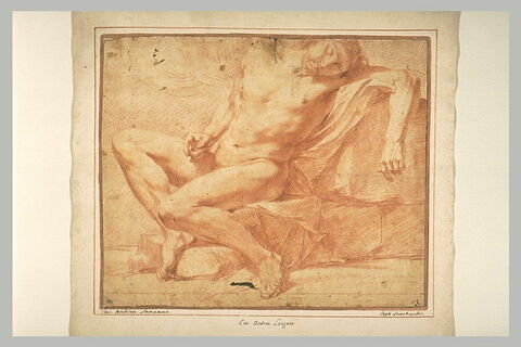 Un homme nu, assis, reposant contre une pierre